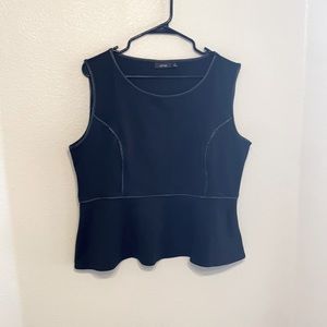 Woman’s black and faux leather peplum shirt